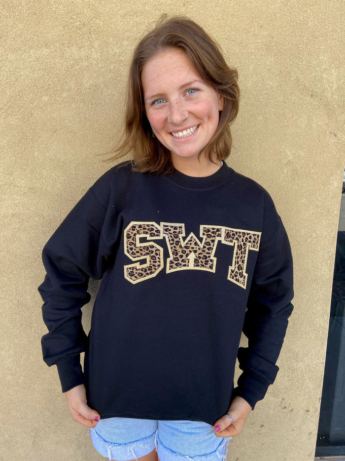 "SWT" Logo Arched on Cheetah on Gold Fabric sewn on a Black Sweatshirt